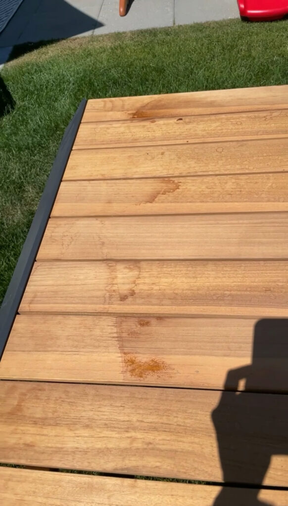 Samantha's outdoor patio table pre-refinishing. It has quite orange tones.