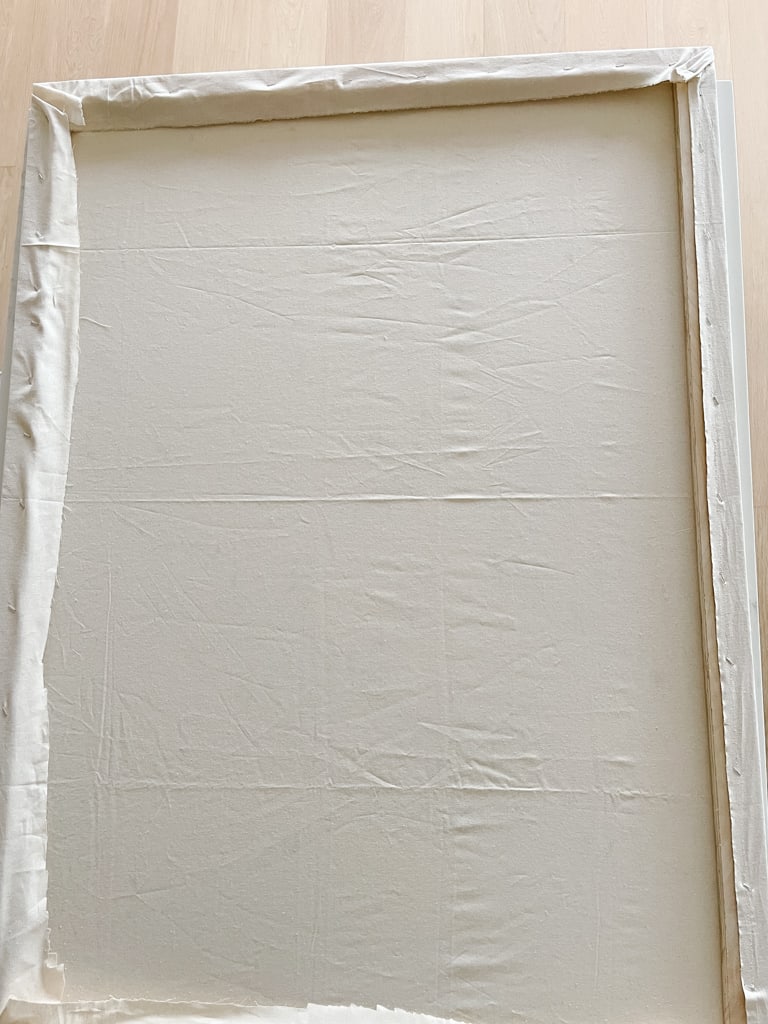 the back of the mounted canvas. The frame and the canvas fabric wrapped around it.