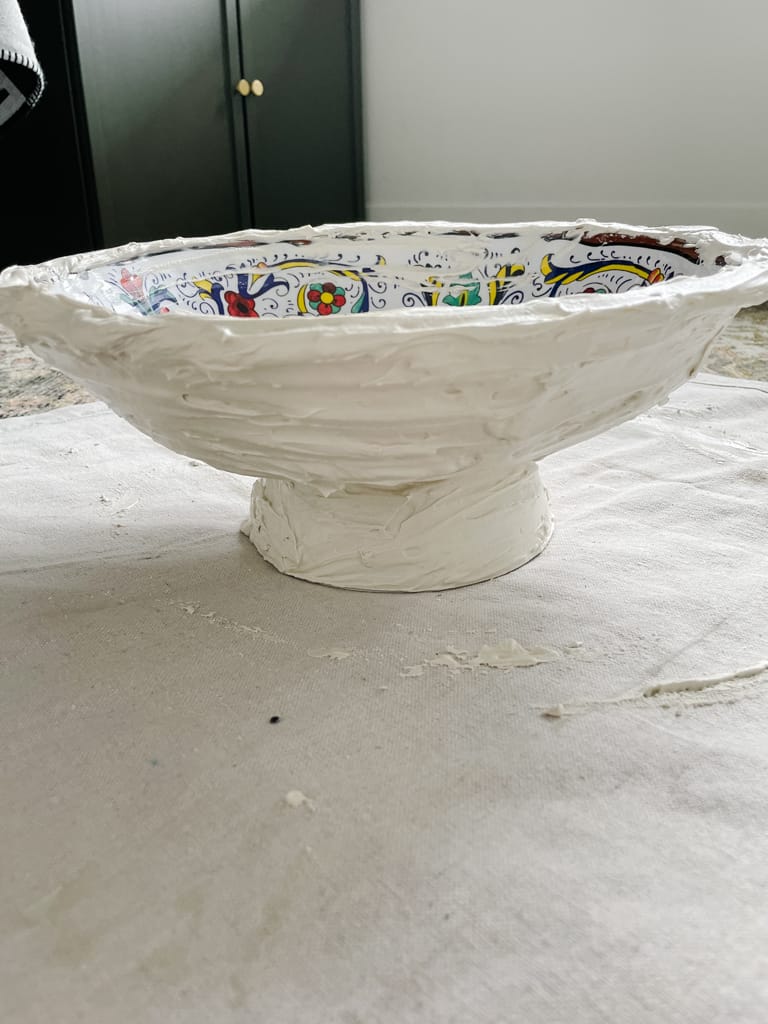 easy pedestal bowl DIY in progress - two bowls glued together bottom to bottom with plaster around it all.