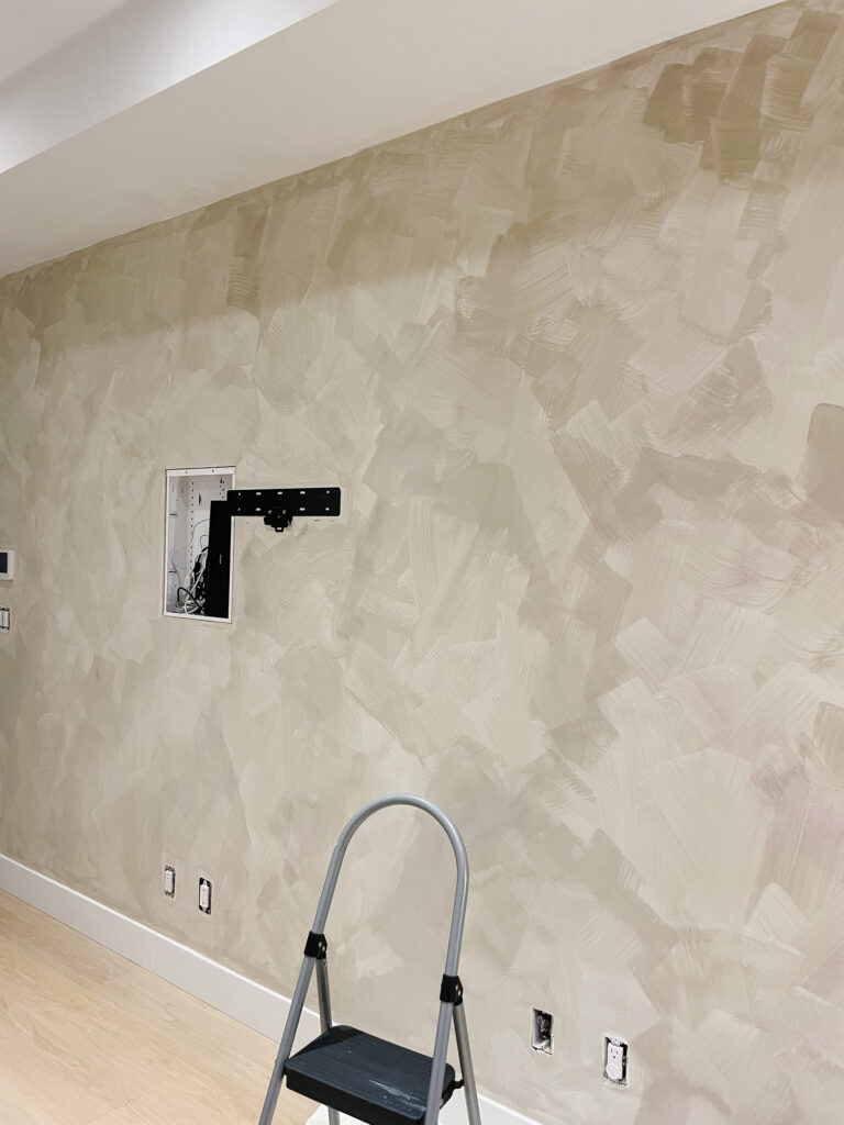 progress of lime wash going onto a wall