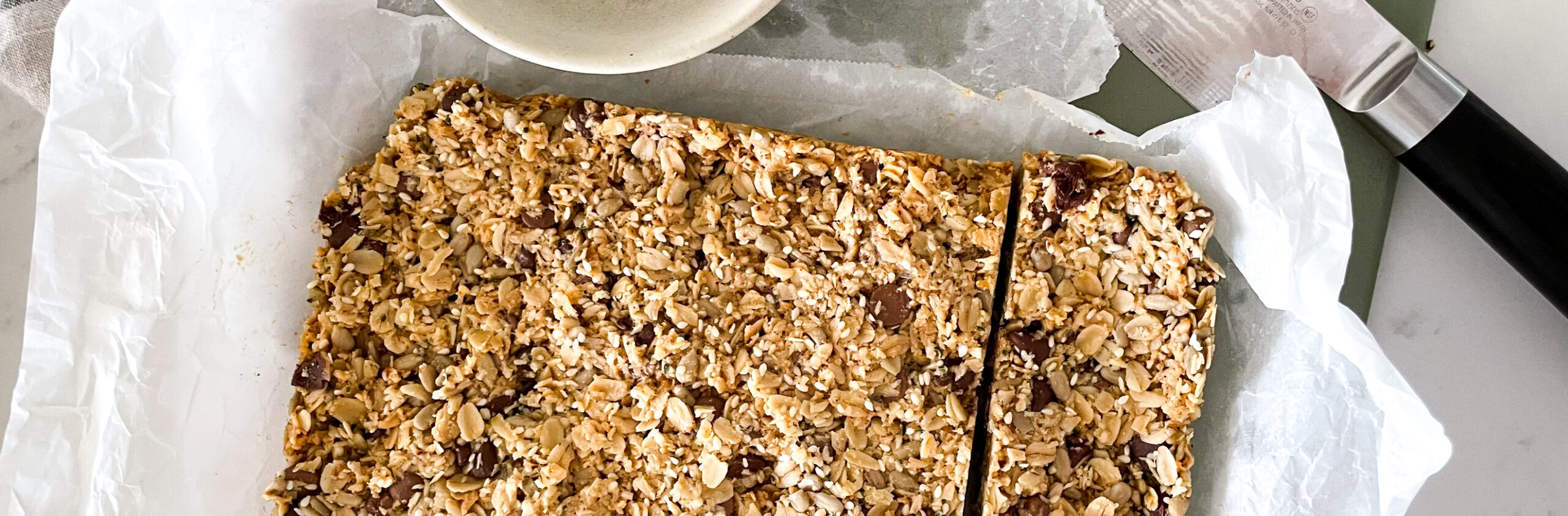 Delicious nut and seed bars fresh out of the baking pan - fittingly called birdie bars