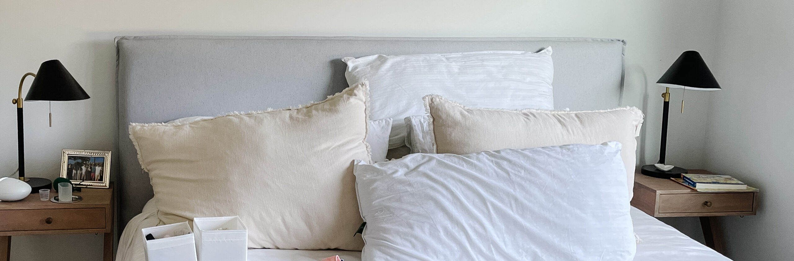 location of home office 2.0 - a picture of a bed with a bunch of kids clothes on it