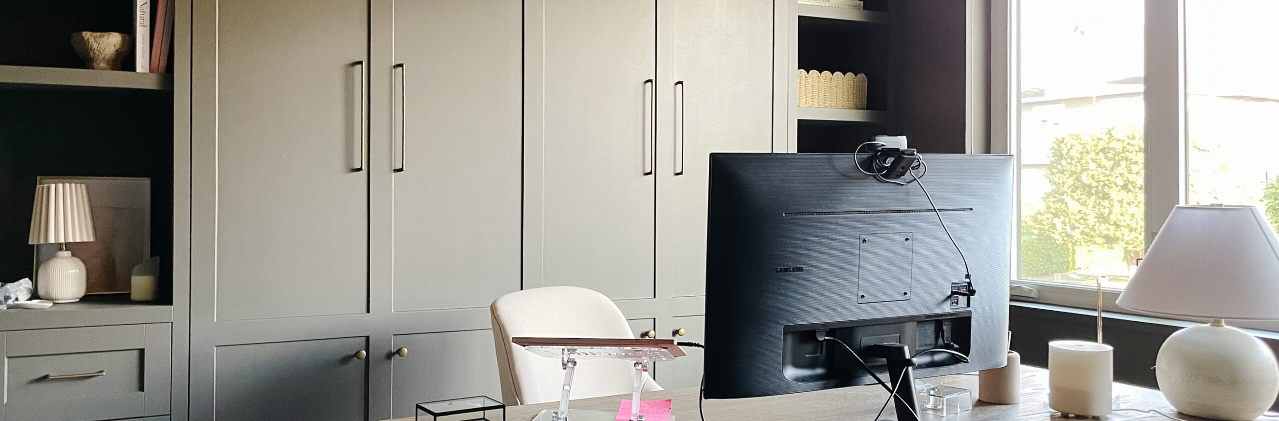 office built ins painted sherwin williams urbane bronze with a wood office desk in the middle of the room