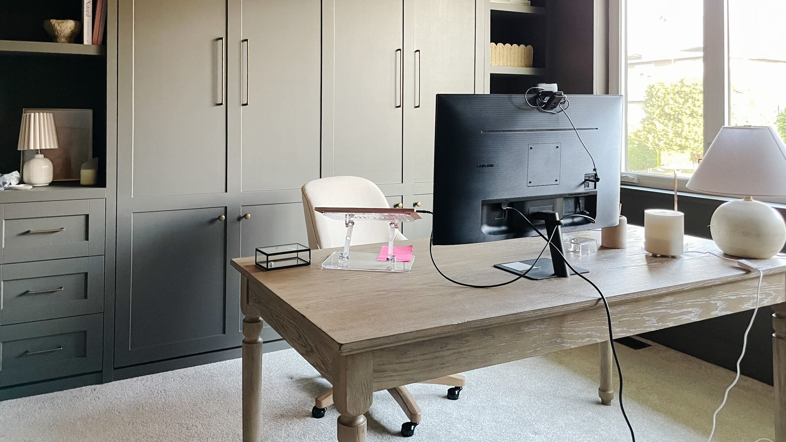 office built ins painted sherwin williams urbane bronze with a wood office desk in the middle of the room