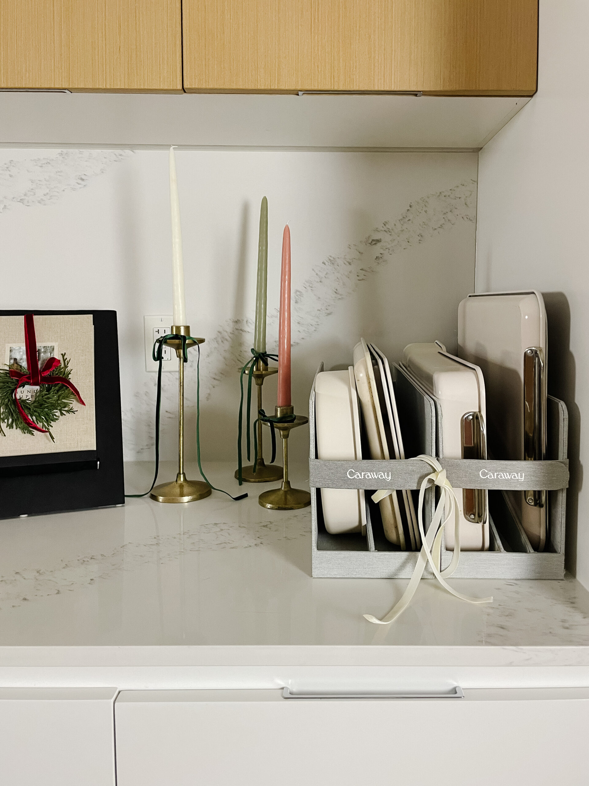 Caraway bakeware set on the kitchen counter wrapped up in ribbon