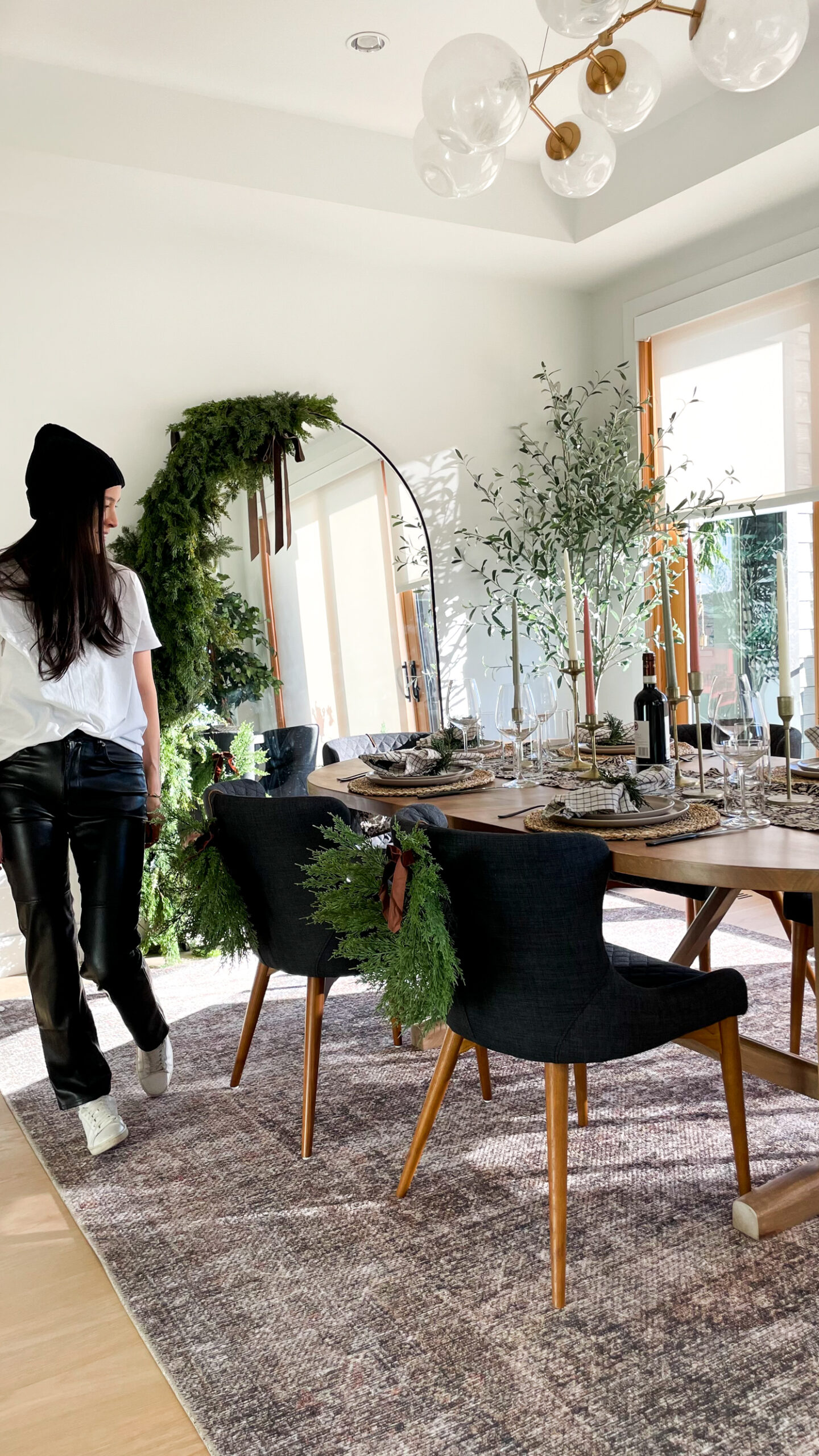 women dressed in holiday outfit walking in dining room