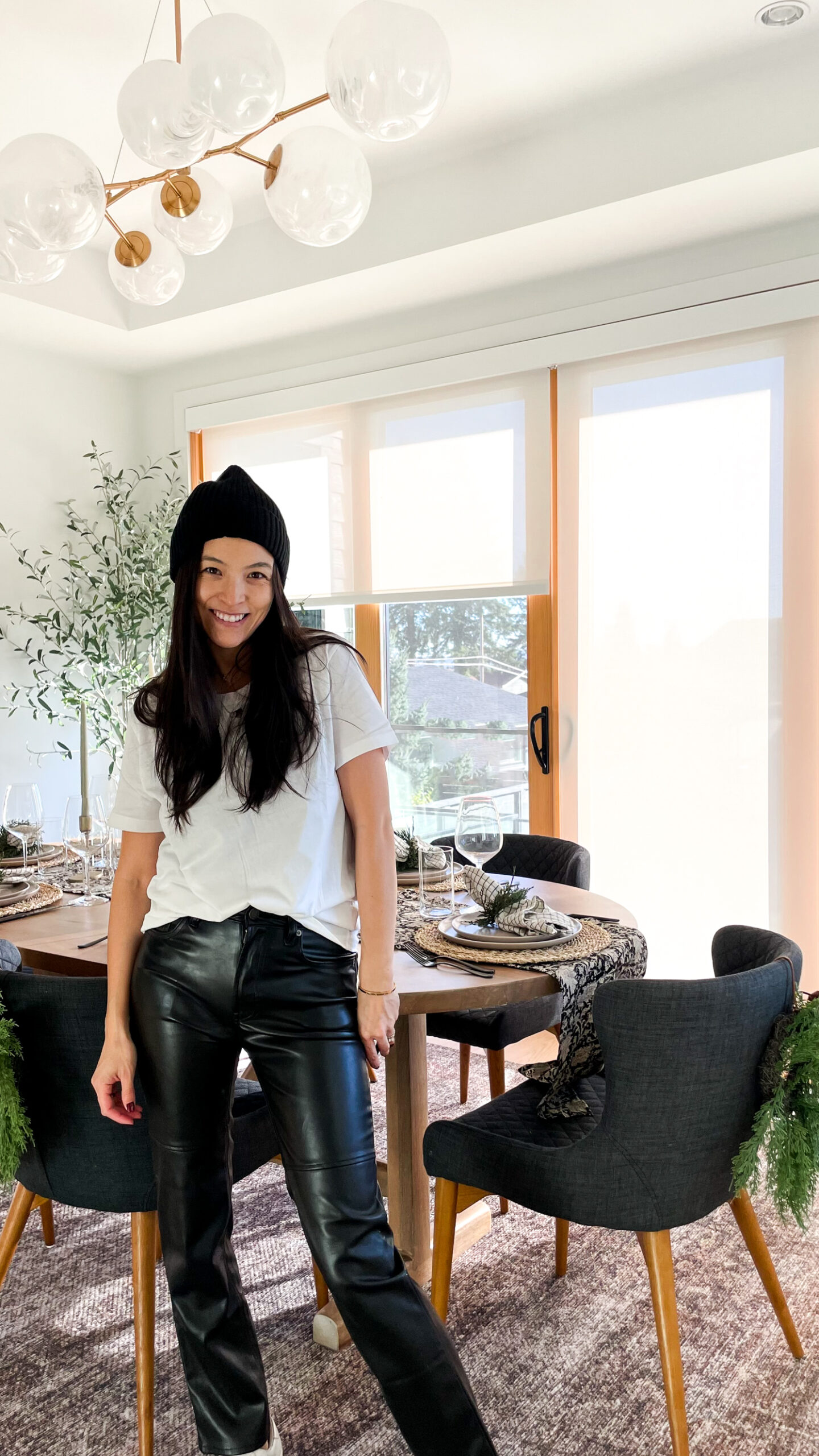 women dressed in holiday outfit walking in dining room