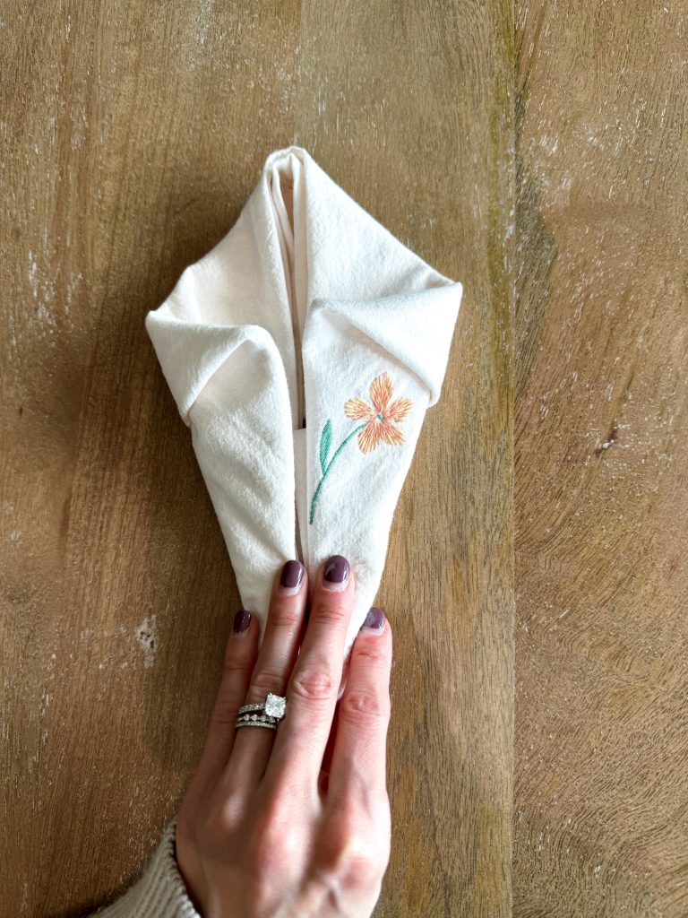 folding a napkin into bunny ears