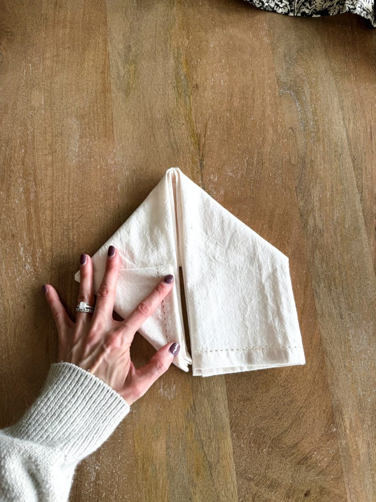 folding a napkin into a bunny