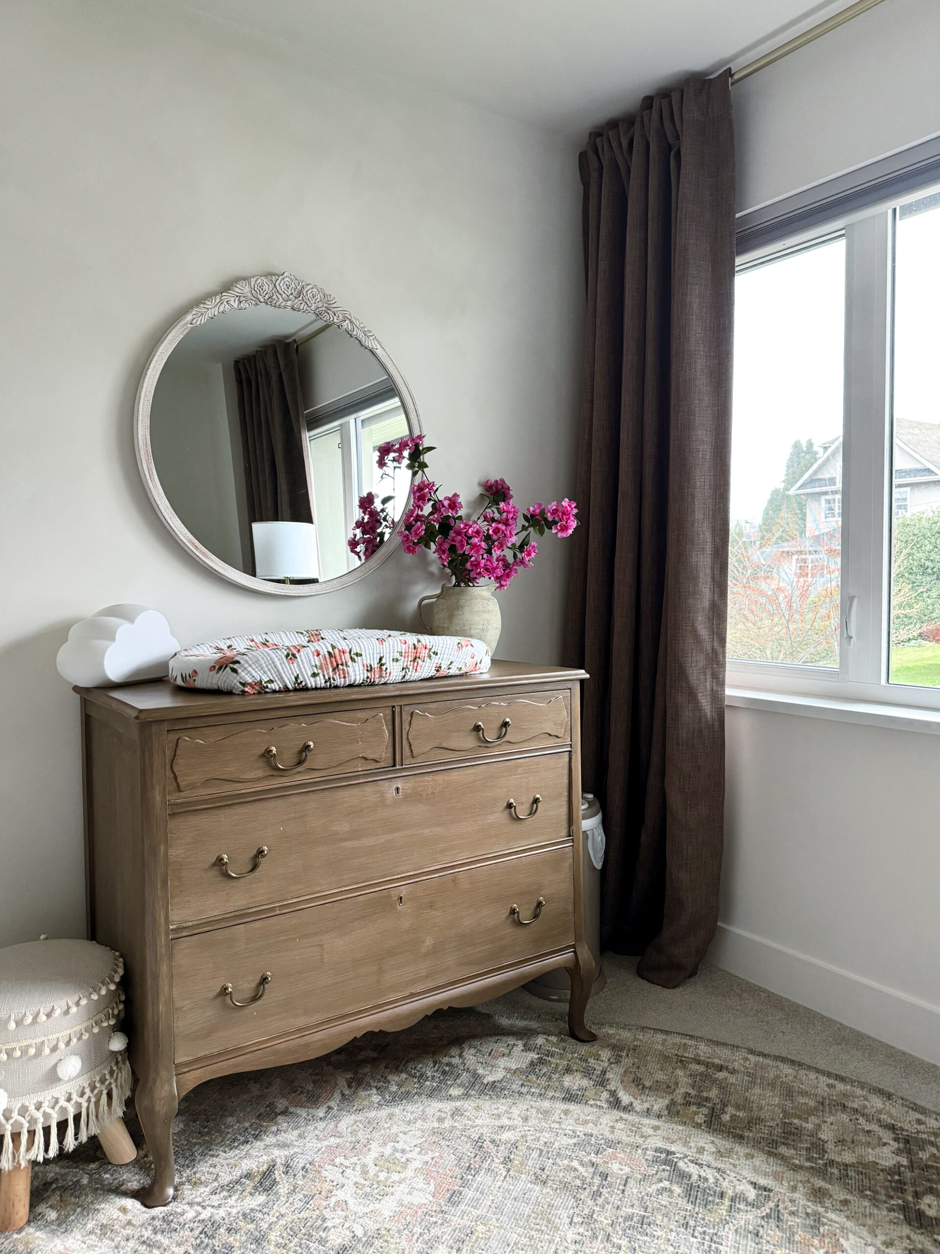 Making your curtains look expensive - a nursery with brown curtains and a dresser as a change table
