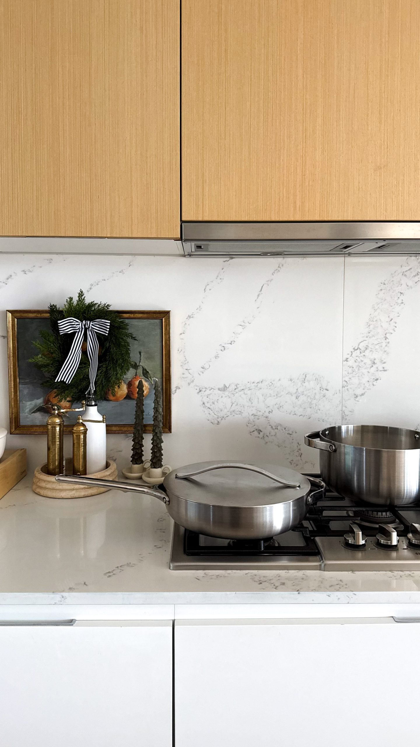 Caraway Cookware all over the countertop