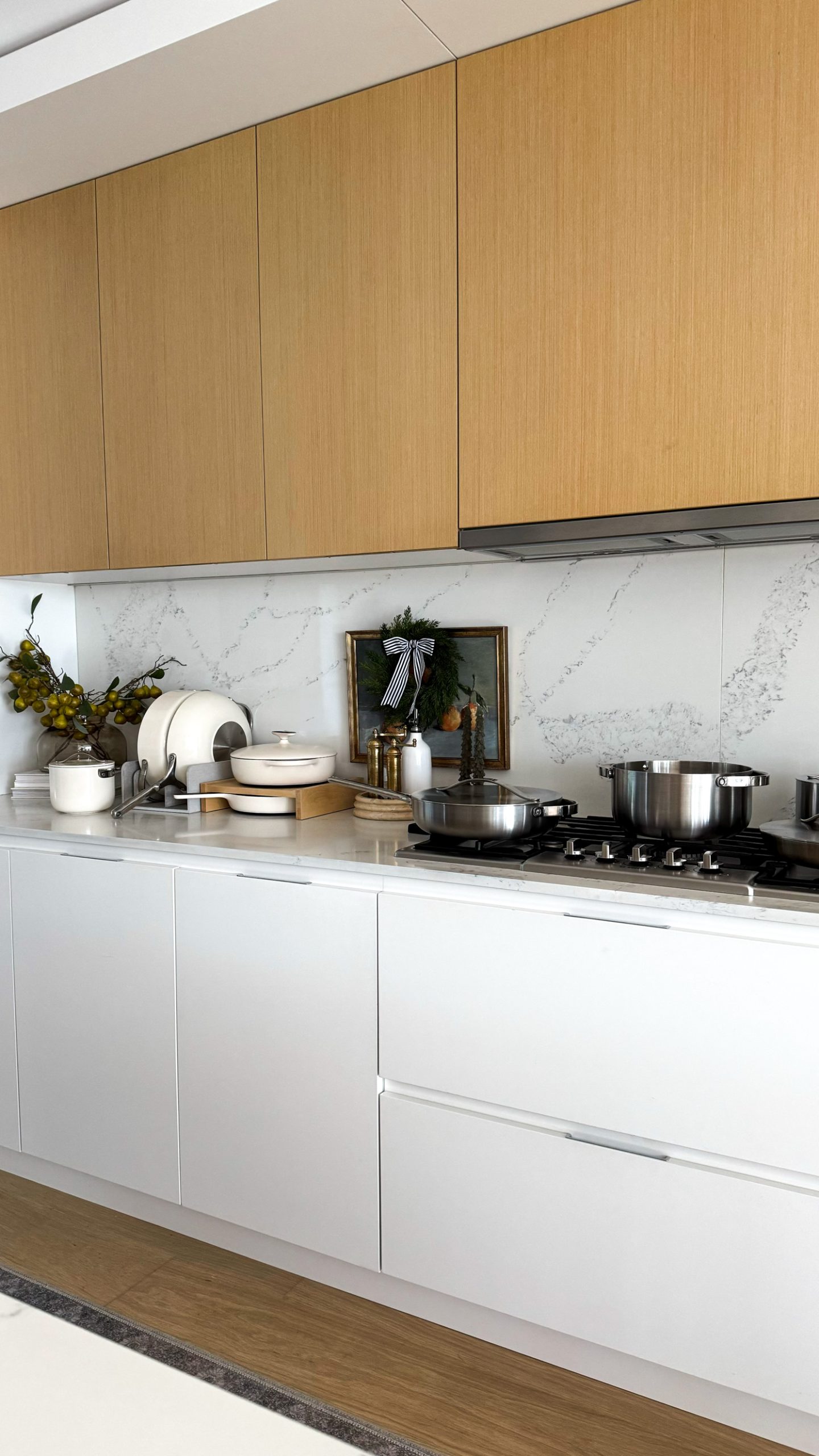 Caraway Cookware all over the countertop