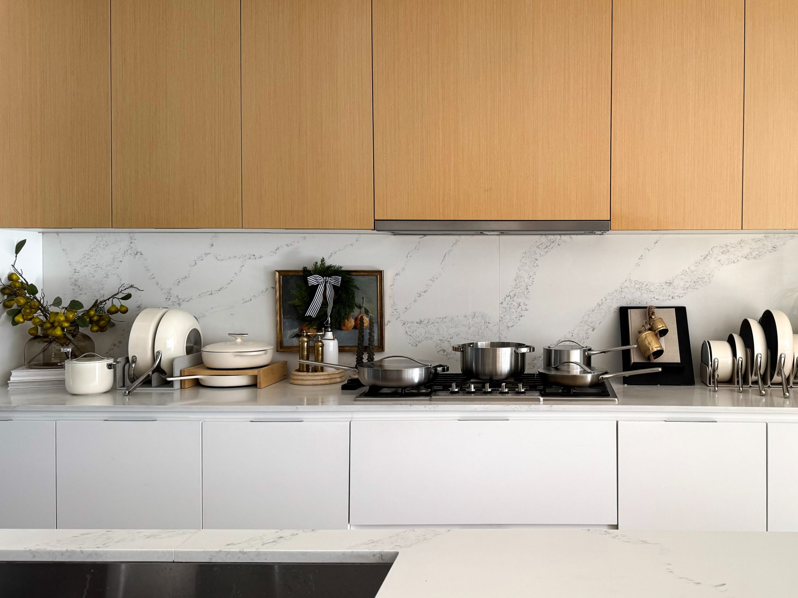 Caraway Cookware all over the countertop