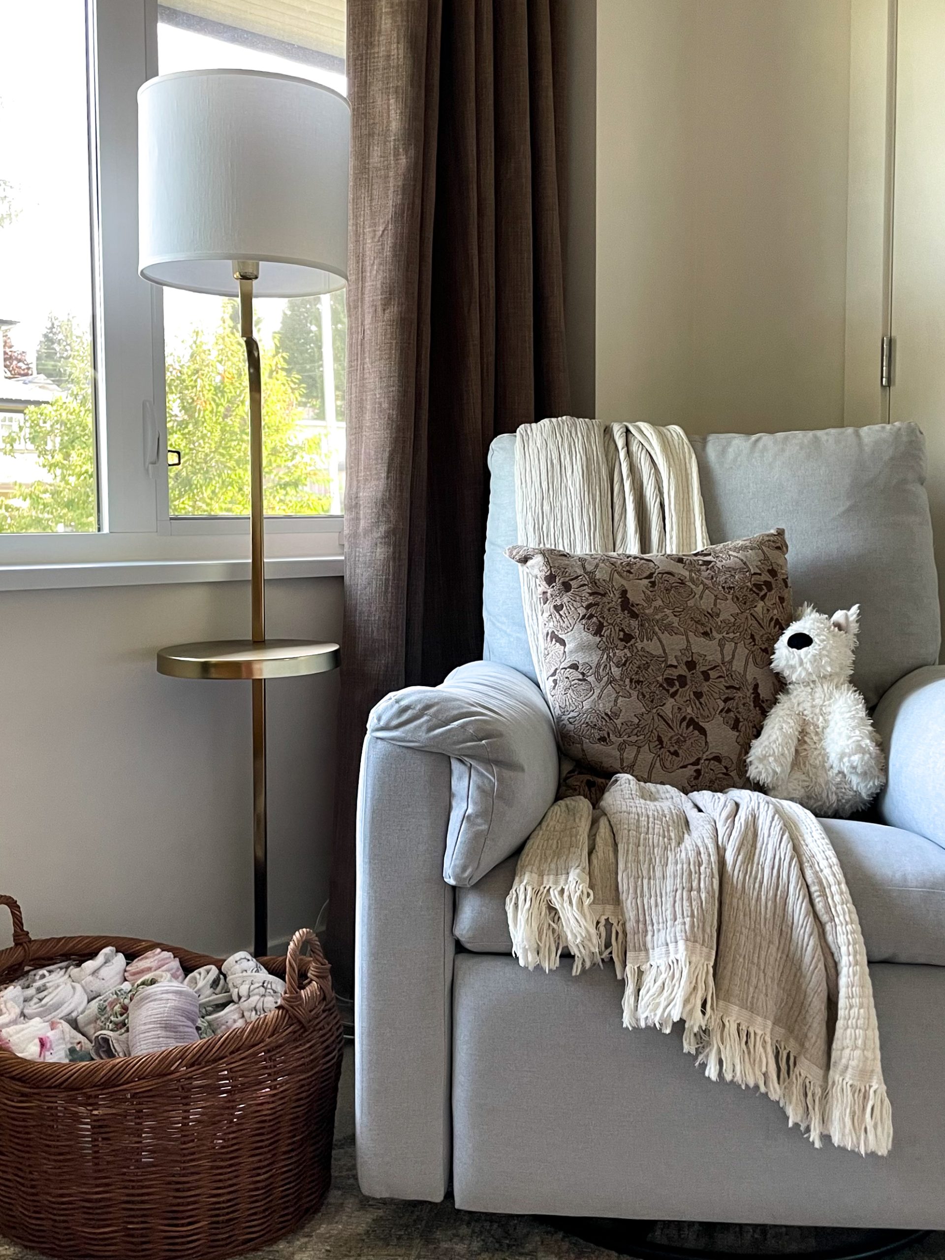 throw pillow updates for spring - a floral brown pillow in a nursery