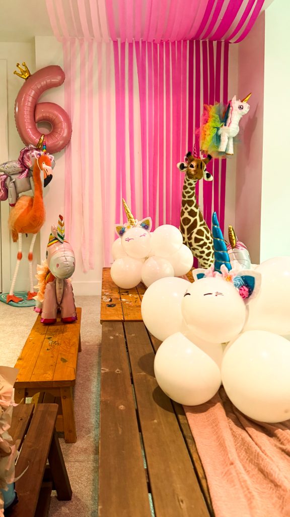 unicorns sitting on a table in the clouds