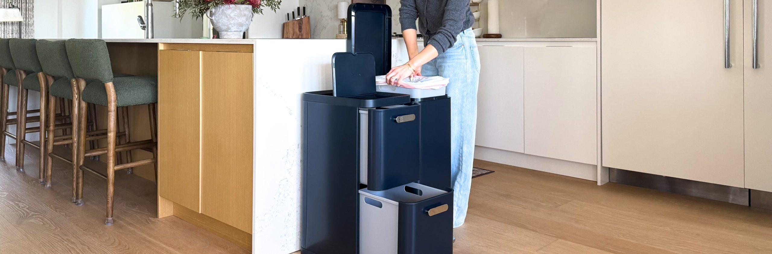 Caraway's new trash and recycling bins in Navy blue.