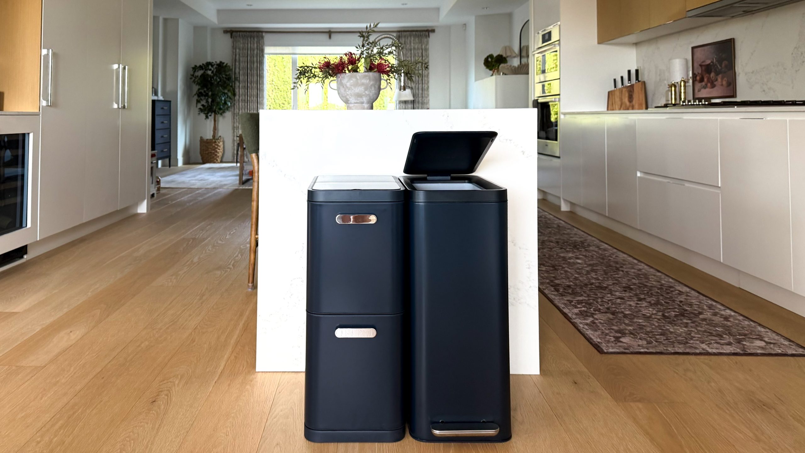 Caraway's new trash and recycling bins in Navy blue.